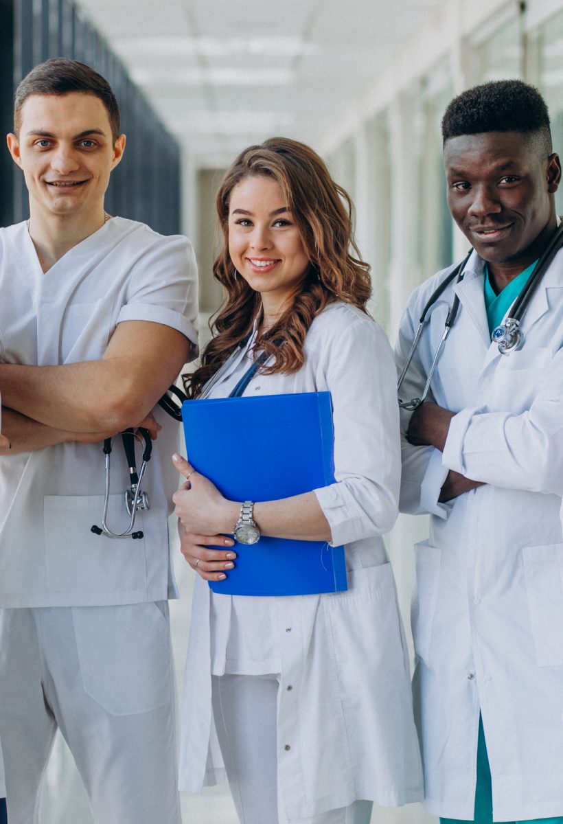 team-young-specialist-doctors-standing-corridor-hospital